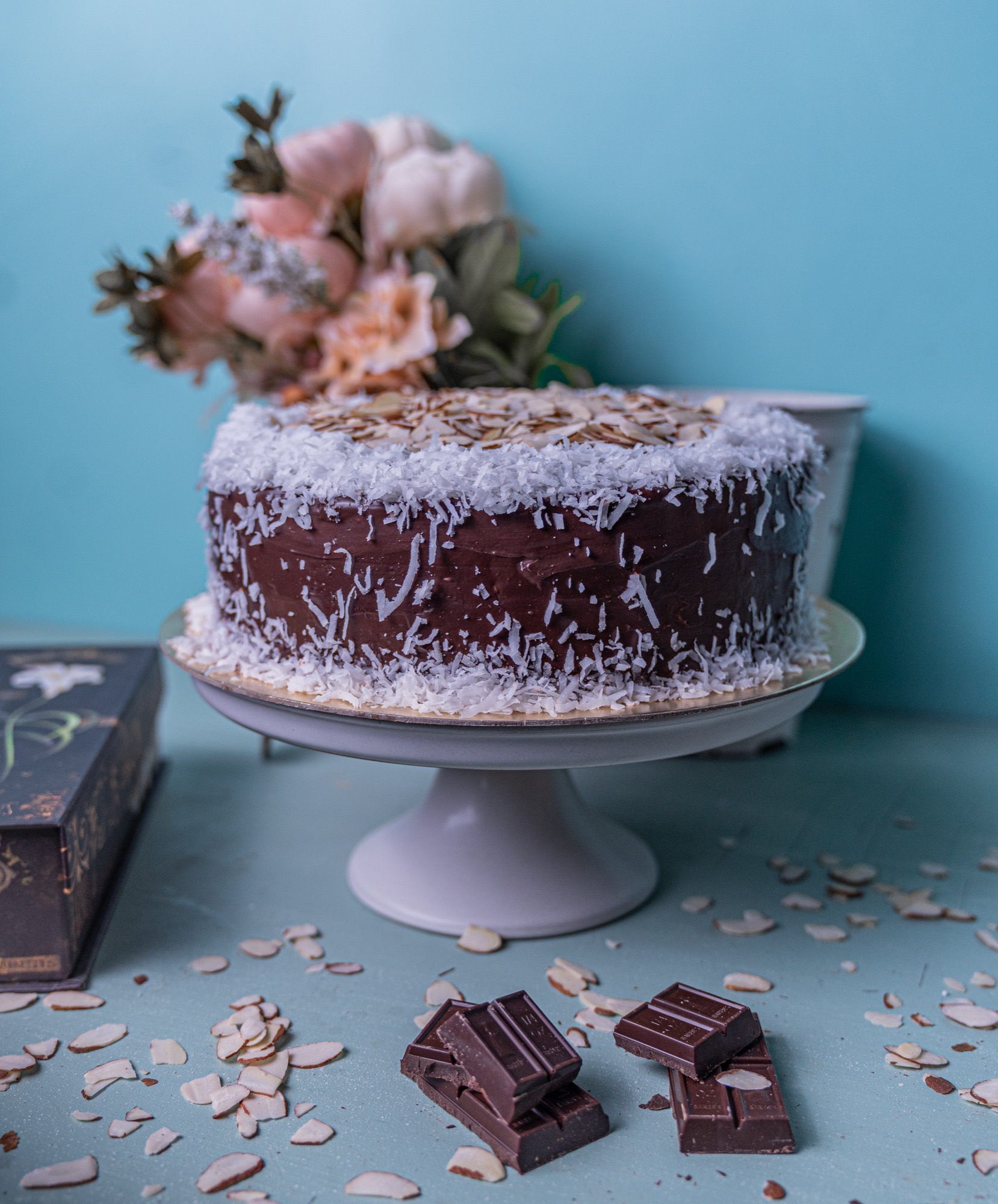 Coconut almond cake styled with dried florals